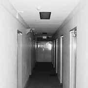 Kalimna - dark hallway on lower level (note doorways are staggered)